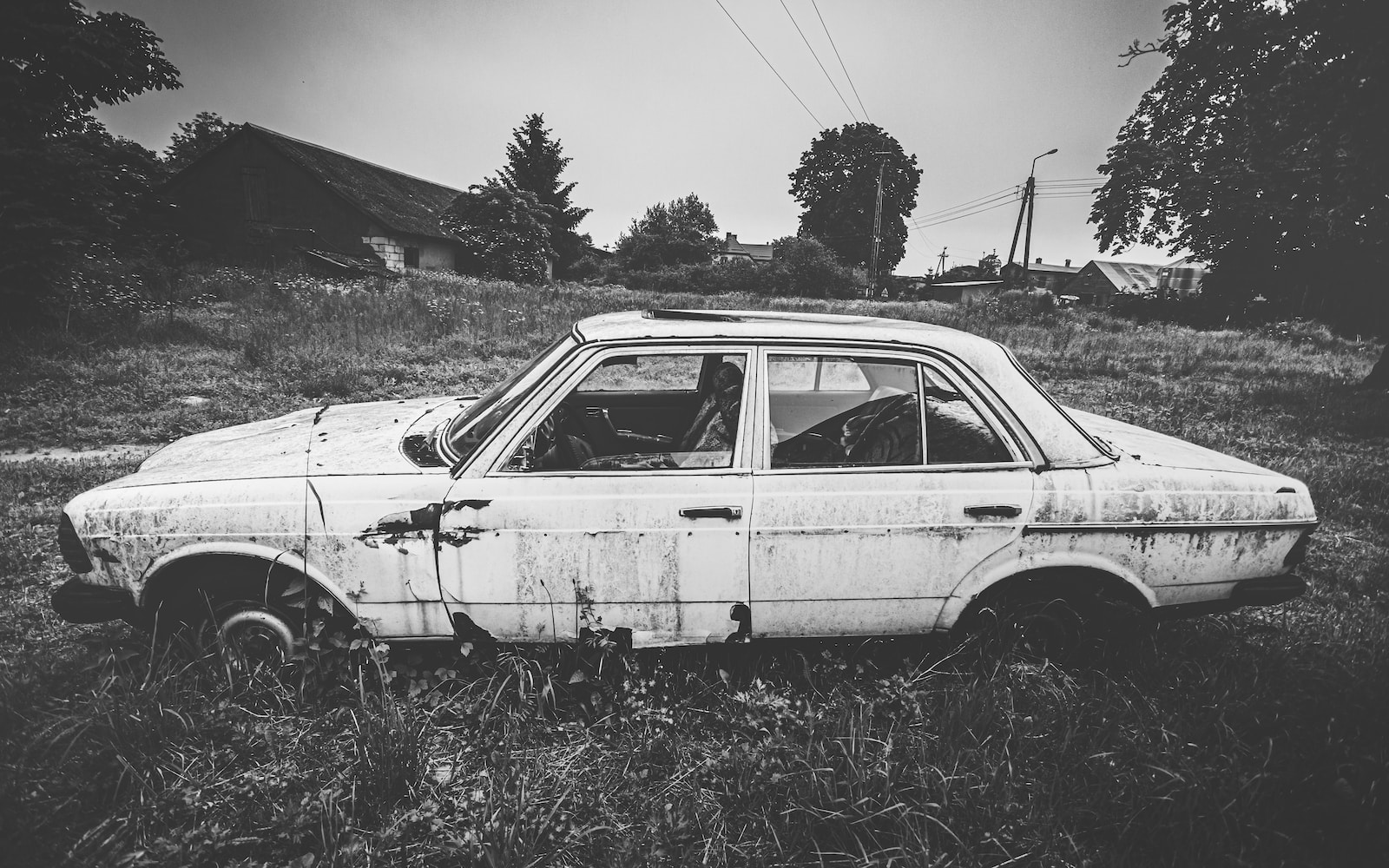 grayscale photo of vintage car